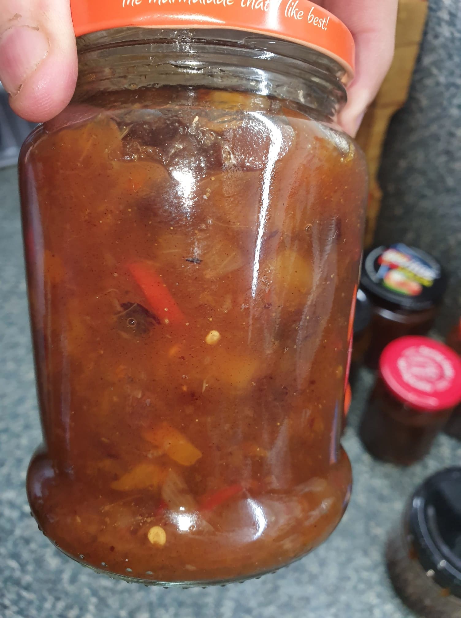Close-up view of mango chutney in a jar